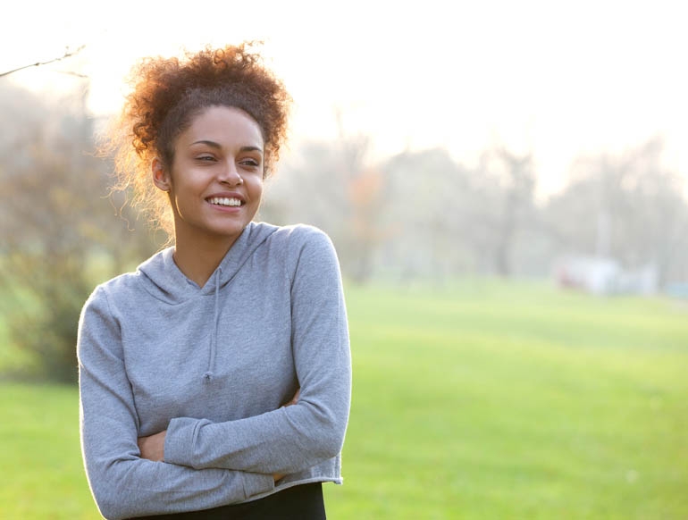 healthy woman standing in a park