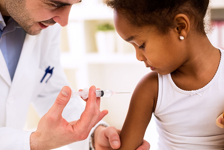 Child receiving back to school vaccines 