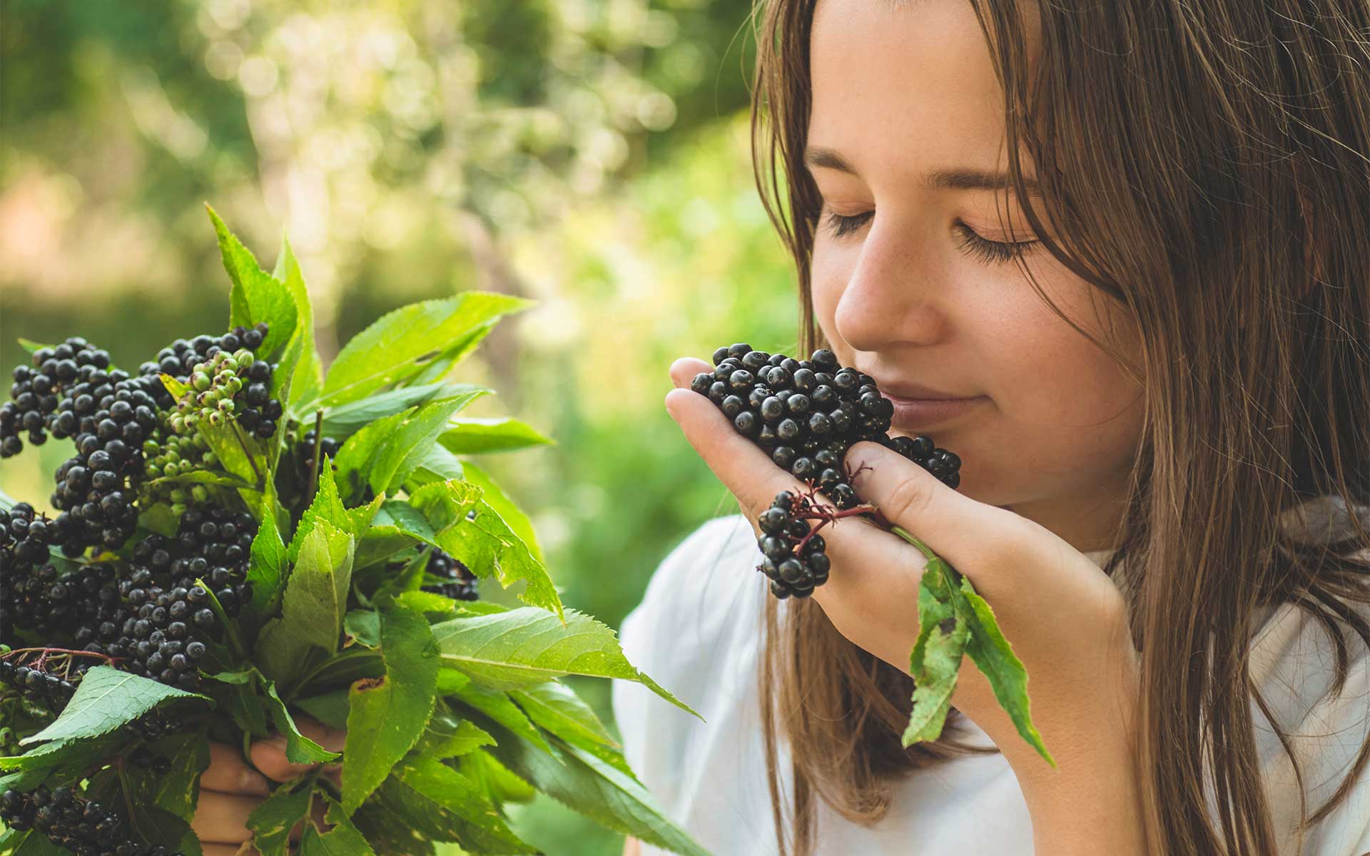 Woman Smelling Elderberry