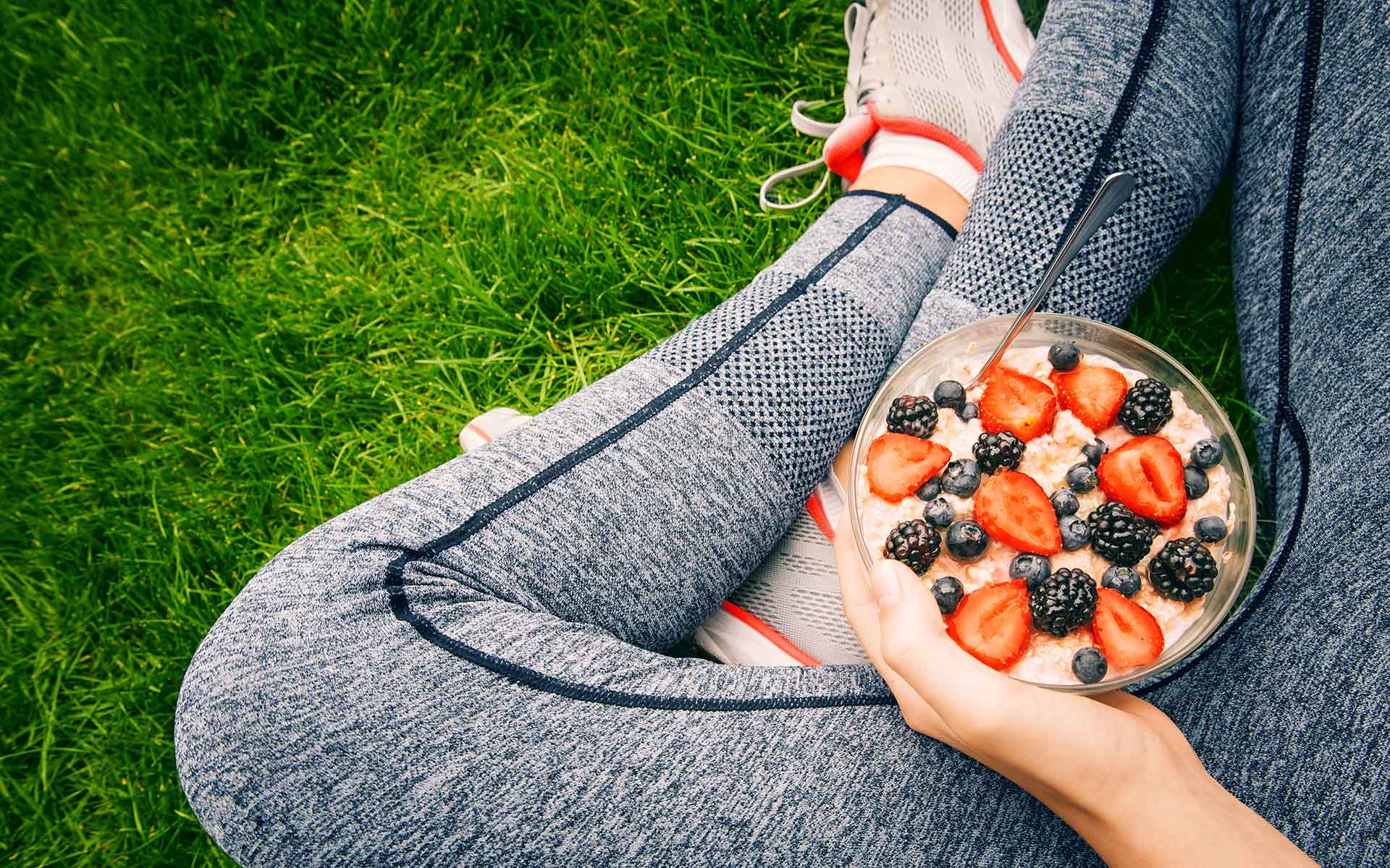 Girl eating porridge with berries