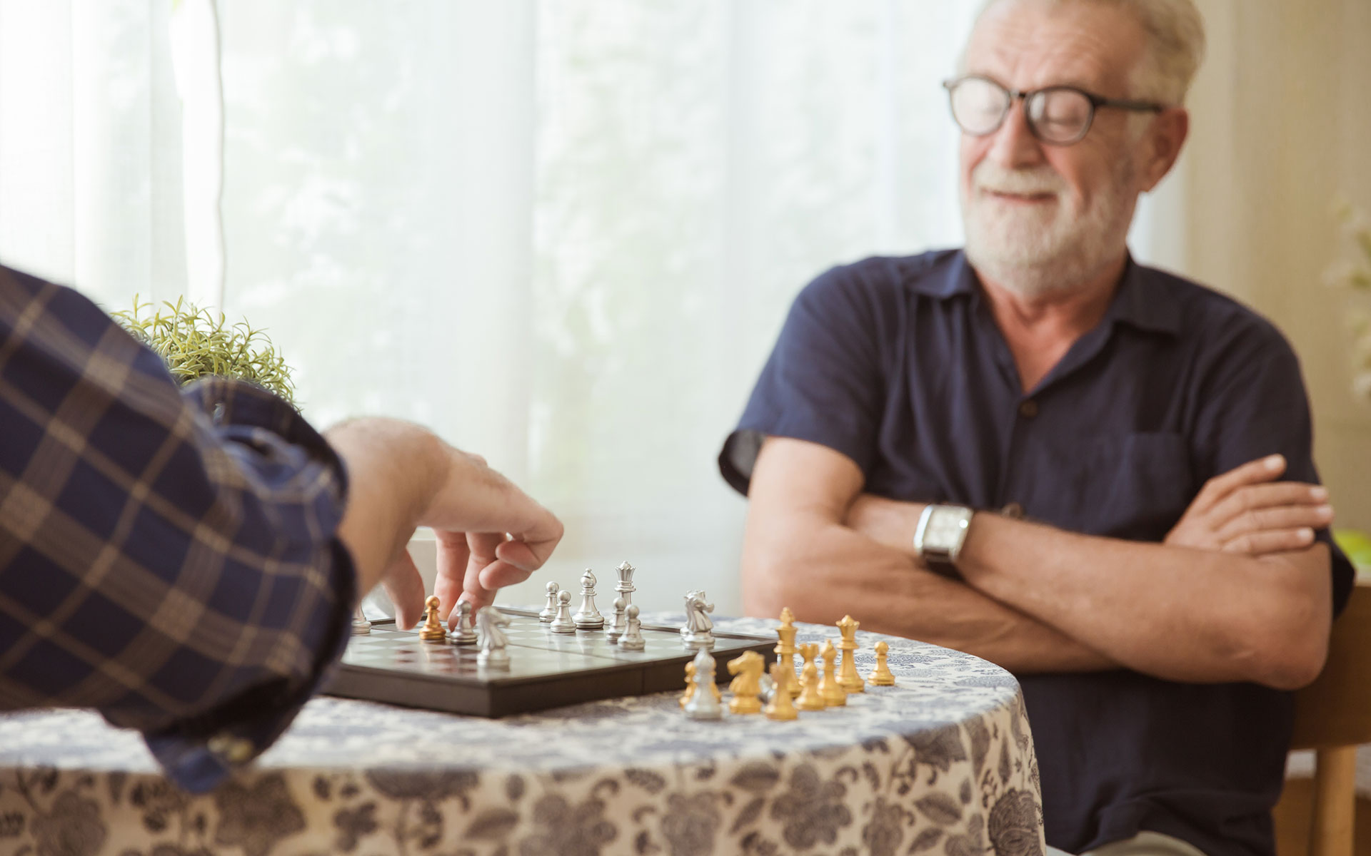 Elderly man enjoying a game of chess