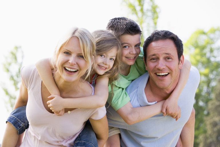 A happy healthy family playing in the sun